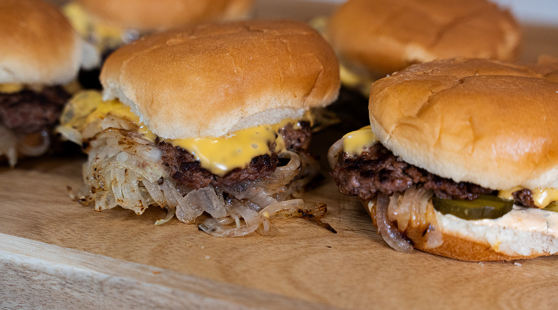 Smash burgers on a cutting board